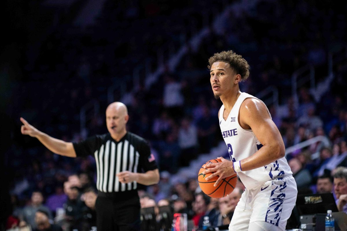 K-State guard Max Jones holds the ball during K-State's loss to Texas Tech on Jan. 14. Jones nearly notched a double-double across 39 minutes.