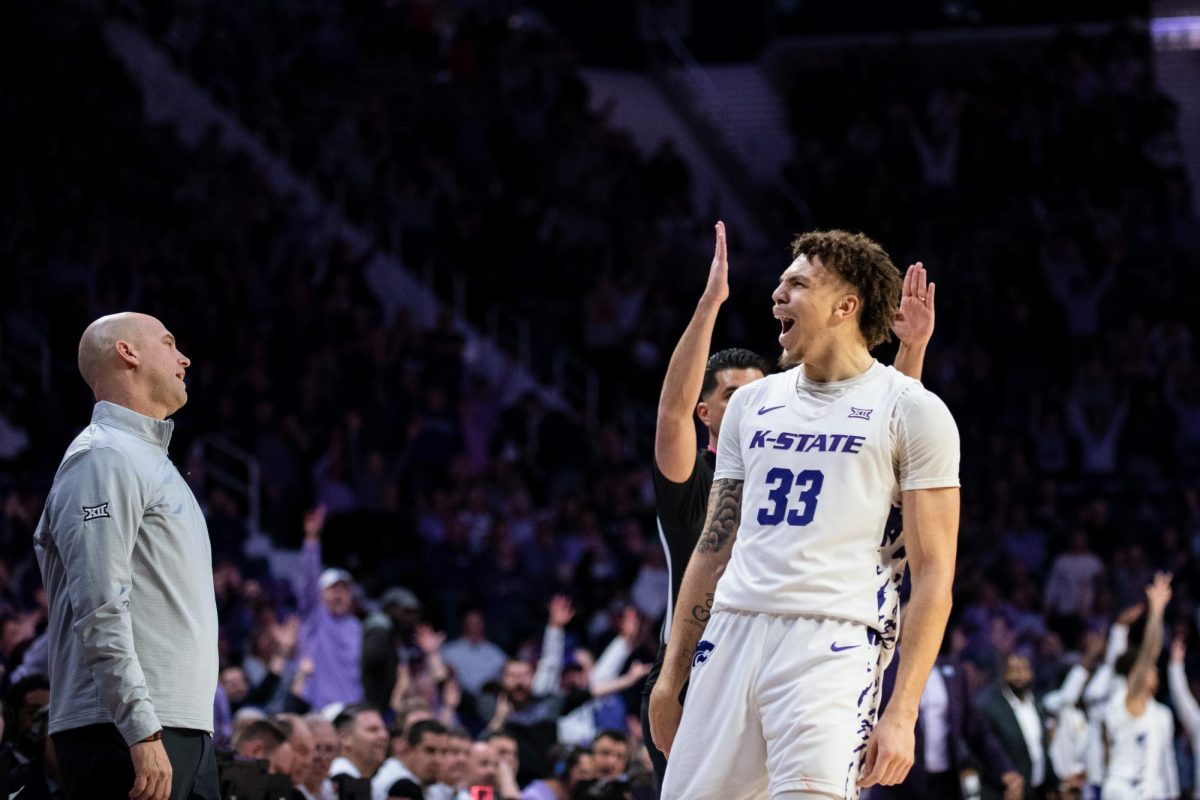 K-State forward Coleman Hawkins reacts from an impressive 3-pointer during K-State's 85-57 win over Oklahoma State on Wednesday. The Illinois transfer led an all-around dominant performance, as he grabbed a game-high nine rebounds to go with his 15 points, six assists, three steals and three blocks in 33 minutes.