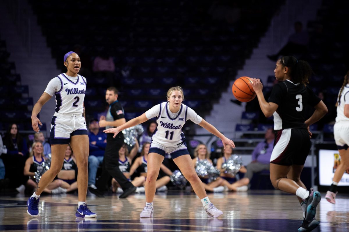 Forward Temira Poindexter (2) and guard Taryn Sides (11) await on defense as New Mexico State brings the ball down the court. The Wildcats caused offensive troubles for the Aggies, holding them to 39 points in the win on Dec. 18.