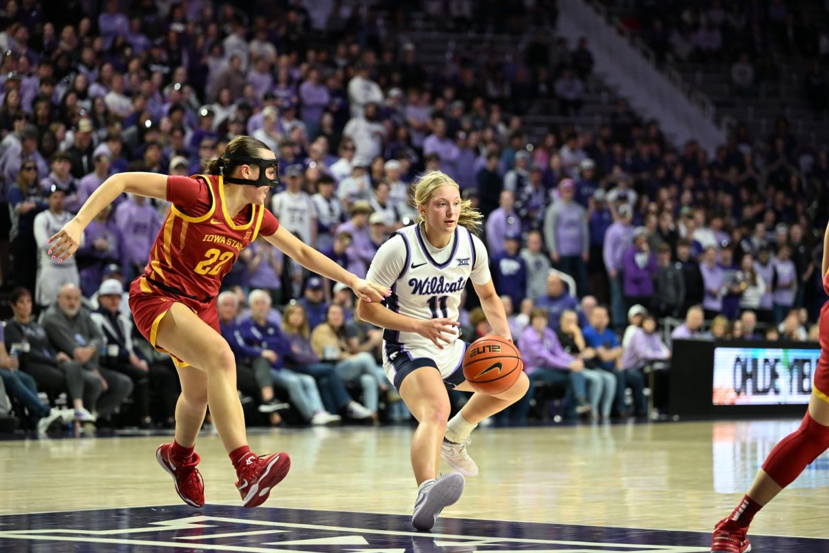 K-State guard Taryn Sides evades a Cyclone defender during K-State's overtime win over Iowa State on Thursday. Sides had 17 points on 6-of-9 shooting including a perfect 4-of-4 from distance, five rebounds, five assists and four steals.