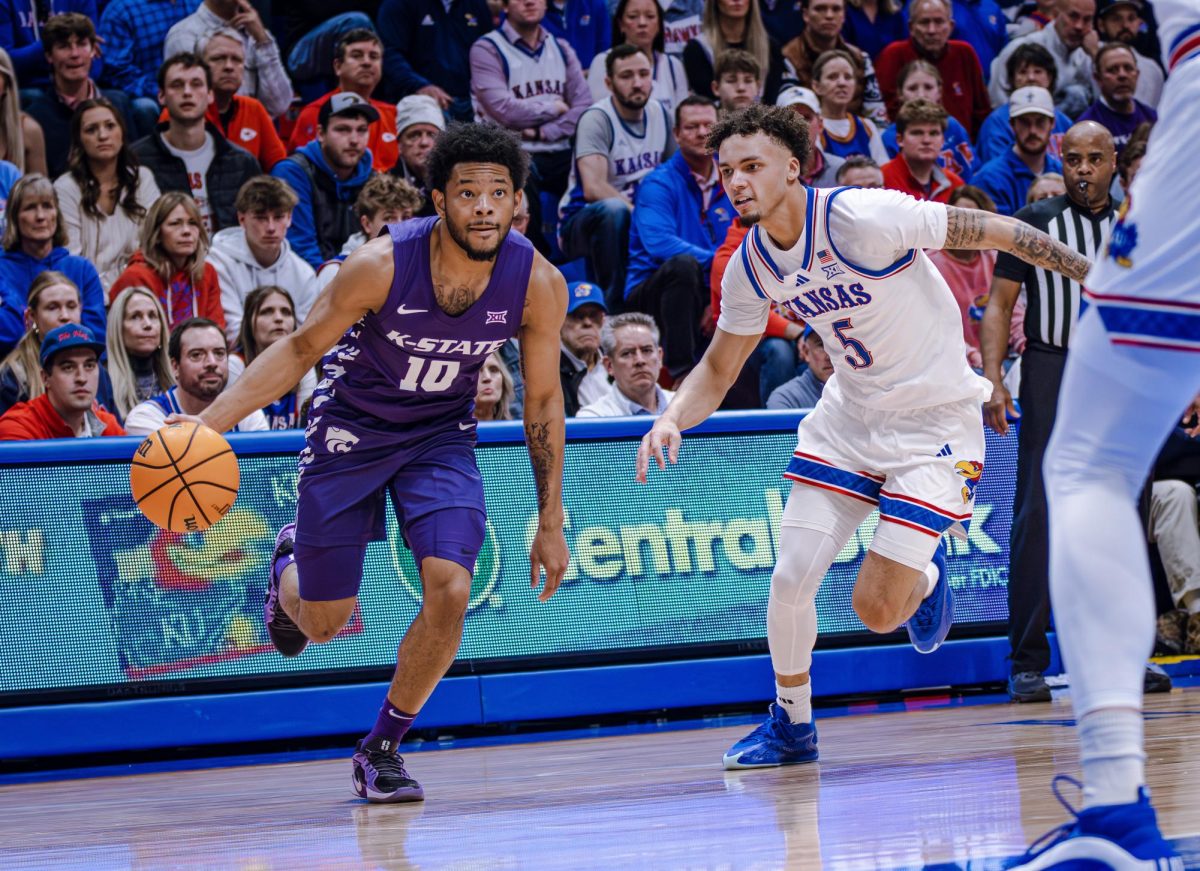 Kansas State freshman David Castillo cuts toward the hoop in the 2025 Sunflower Showdown at Allen Fieldhouse on Jan. 19. The true freshman guard played a career-high minutes in the 10-point loss.