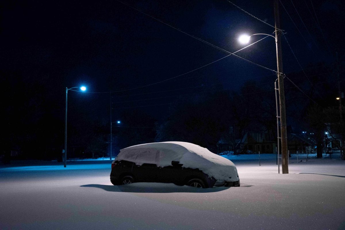 A minivan is buried in over a foot of snow following the historic winter storm on Jan. 5 in Manhattan. 