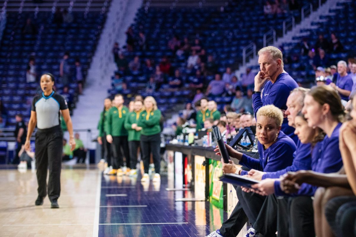 K-State head coach Jeff Mittie looks onto the court during K-State home loss against Baylor on Monday.