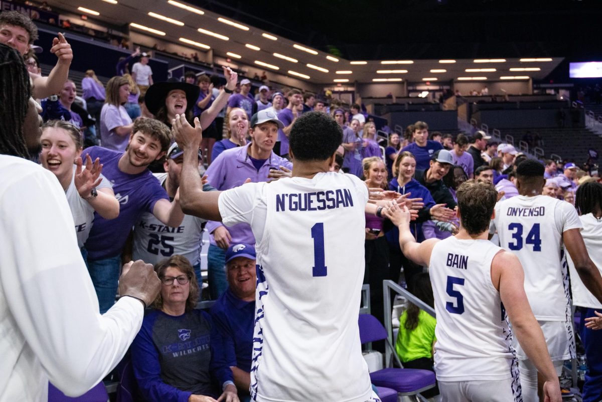 Players David N'Guessan (1), Spencer Bain (5), Ugonna Onyenso (34) and others thank the fans in the student section following a dominating 85-57 victory over Oklahoma State on Jan. 29 in Bramlage Coliseum.