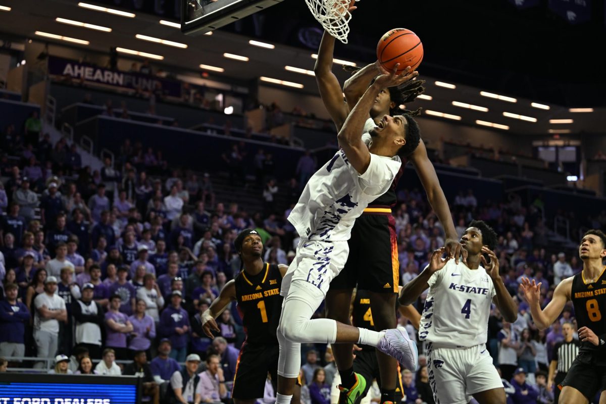 Senior forward David N'Guessan battles for a contest layup attempt against Arizona State on Sunday. The Wildcats lost 66-54 while N'Guessan had 20 points and 13 rebounds.