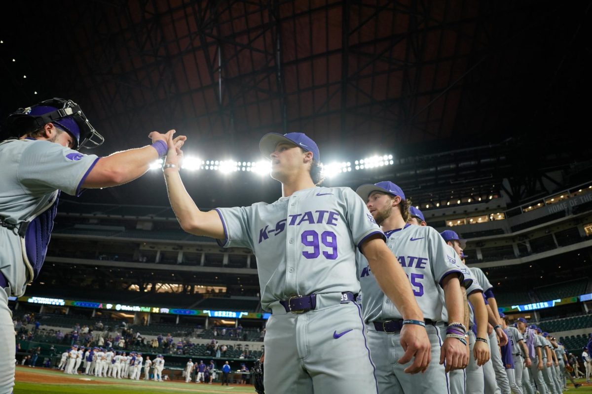 K-State pitcher JJ Slack leads the high-five line after K-State's win over No. 22 TCU on Sunday. The Wildcats swept the Amergy Bank College Baseball field with three wins over Top 25 teams. (Photo courtesy of K-State Athletics)