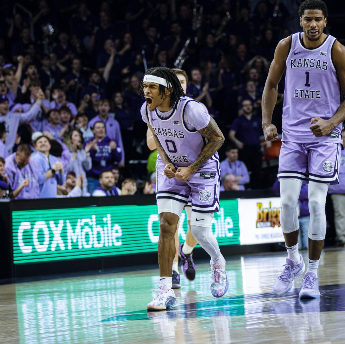 Junior guard Dug McDaniel celebrates a made shot against No. 13 Arizona on Tuesday. McDaniel played a key role in K-State's sixth-straight win.