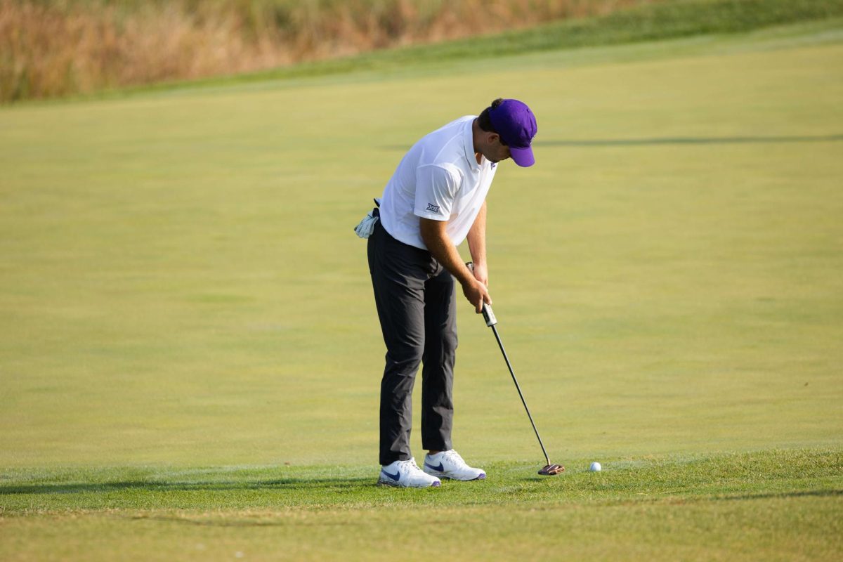 Senior Cooper Shultz rolls a put from off the green at the Wildcat Invitational at Colbert Hills Golf Course on Sept. 17, 2023. Schultz carded a season-best 206 on Tuesday