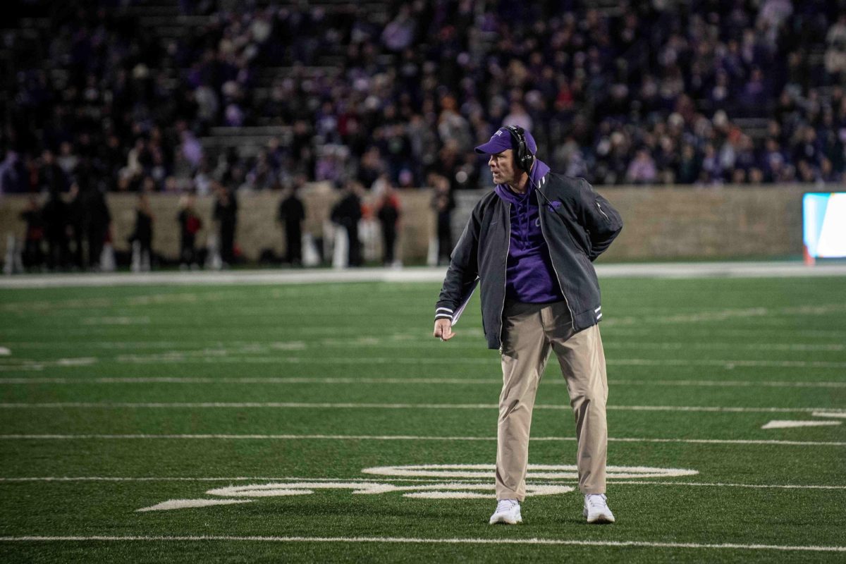 K-State associate head coach and offensive coordinator Matt Wells calls out to the offense late in the fourth quarter against Cincinnati in Manhattan, KS, on Nov. 23, 2024. Wells was promoted to sole OC after the departure of coach Conor Riley to the Dallas Cowboys. (Photo courtesy of Kansas State Athletics)