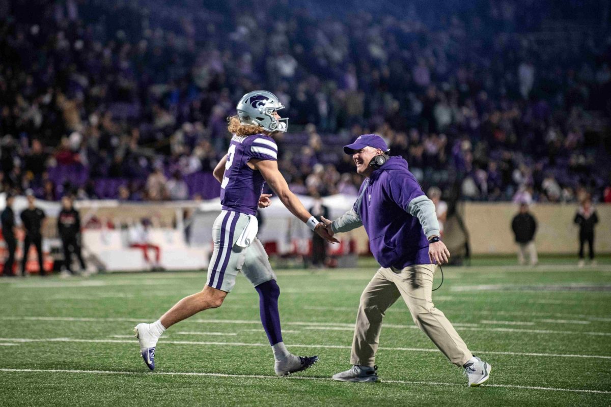 K-State head coach Chris Klieman celebrates with quarterback Avery Johnson during the Wildcats 41-15 win over Cincinnati on Nov. 23. Klieman signed seven transfers to join Johnson on offense in 2025 (Courtesy Photo | K-State Athletics).