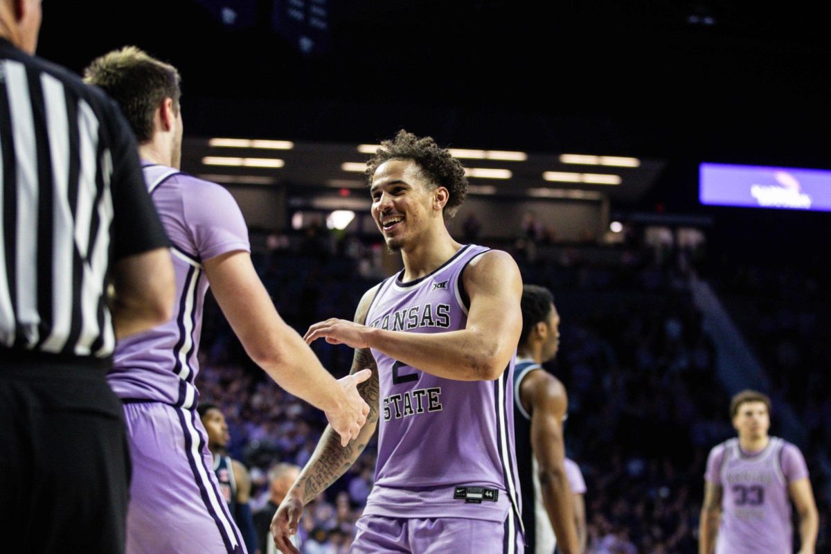 Max Jones smiles after scoring with teammate. The Wildcats continued their winning streak to 6 games with a 73-70 win over Arizona on Feb. 11 at Bramlage Coliseum.