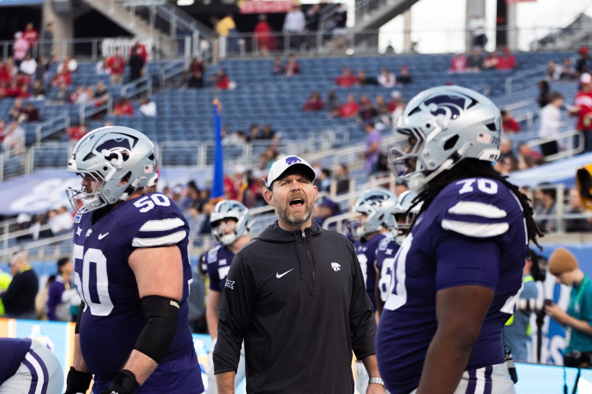 Offensive coordinator/offensive line coach Conor Riley teaches the offensive line before the Pop-Tarts Bowl. Riley served as interim OC for the game and was named permanent OC along with Matt Wells as co-OC for the 2024 season.