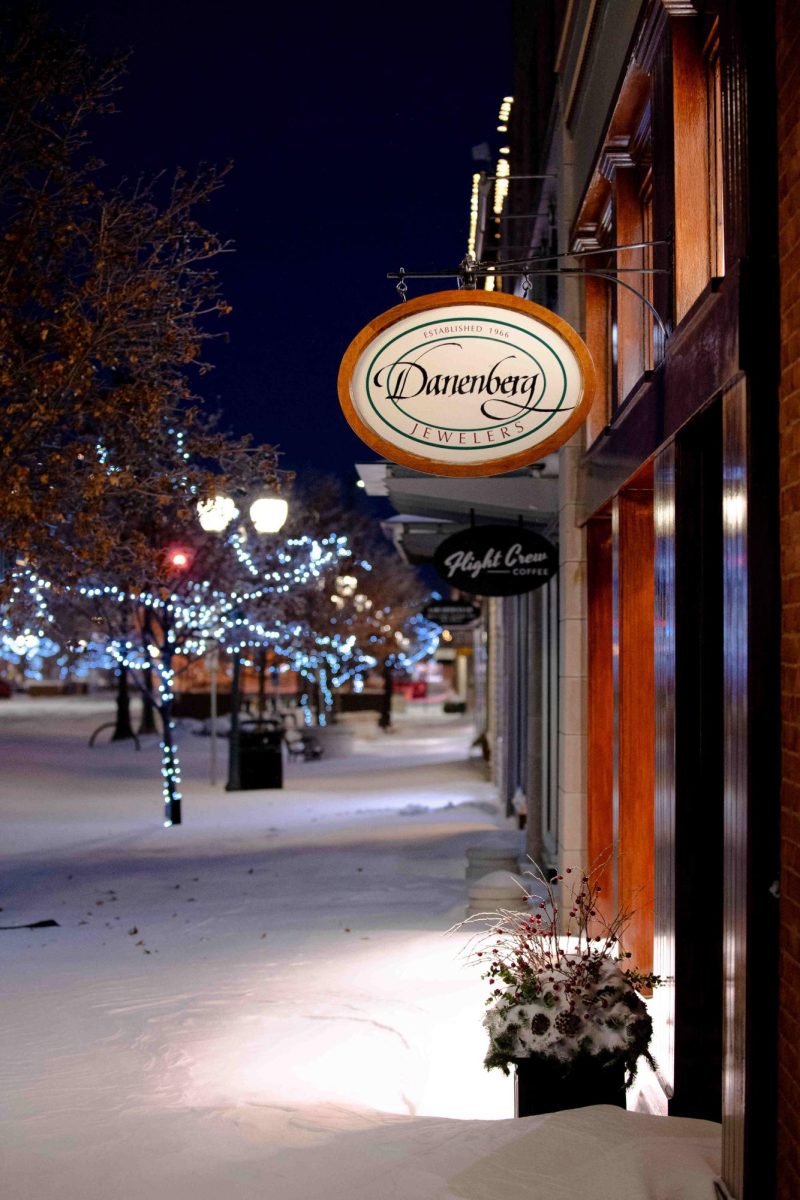 Snow drifts pile up against the windows of businesses, such as Danenberg Jewelers, following the historic snowstorm in Manhattan on January 5, 2025.