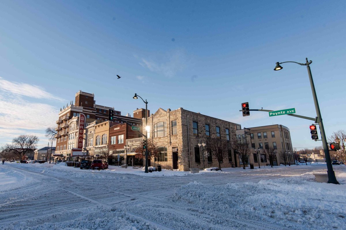 Snow is piled up alongside the intersection of 4th and Poyntz following initial cleanup efforts on January 6, 2025.