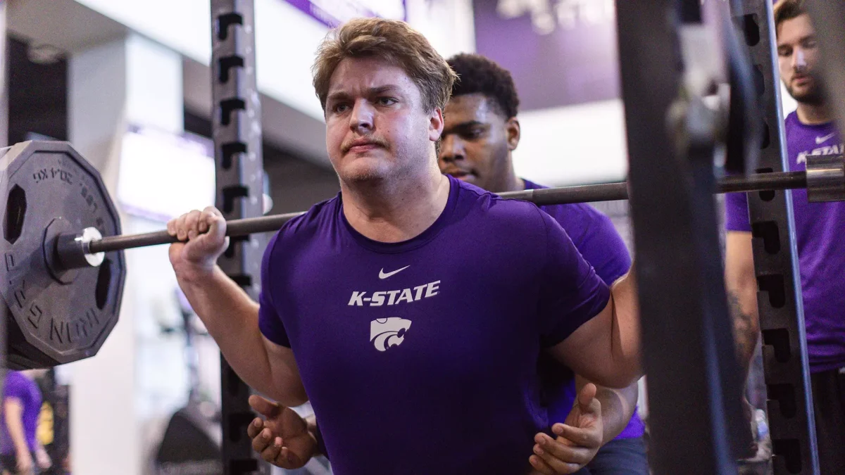 Offensive tackle George Fitzpatrick works out with his new teammates at the Vanier Football Complex. Fitzpatrick transferred from Ohio State, where national champion quarterback Will Howard advised him to come to the Wildcats. (Courtesy Photo of K-State Athletics)