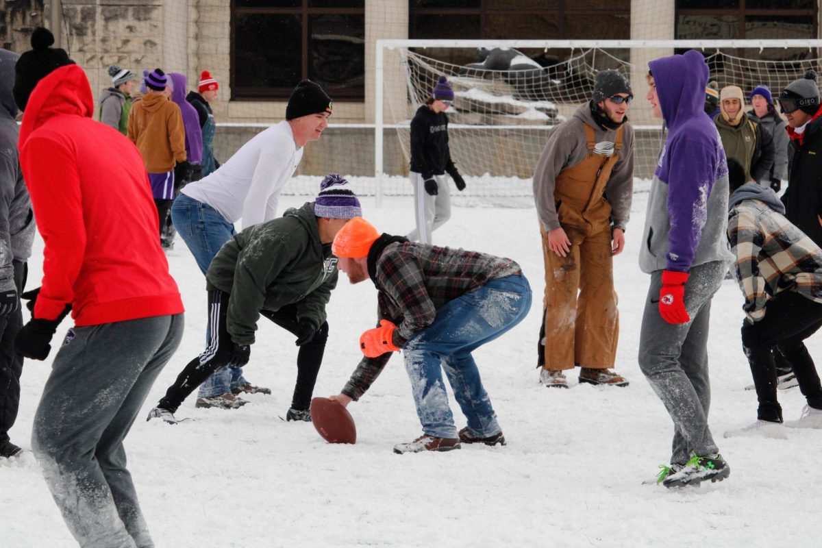 Students lineup before the next play in a football game at Memorial Stadium in Manhattan, KS on Wednesday, Feb. 12. 