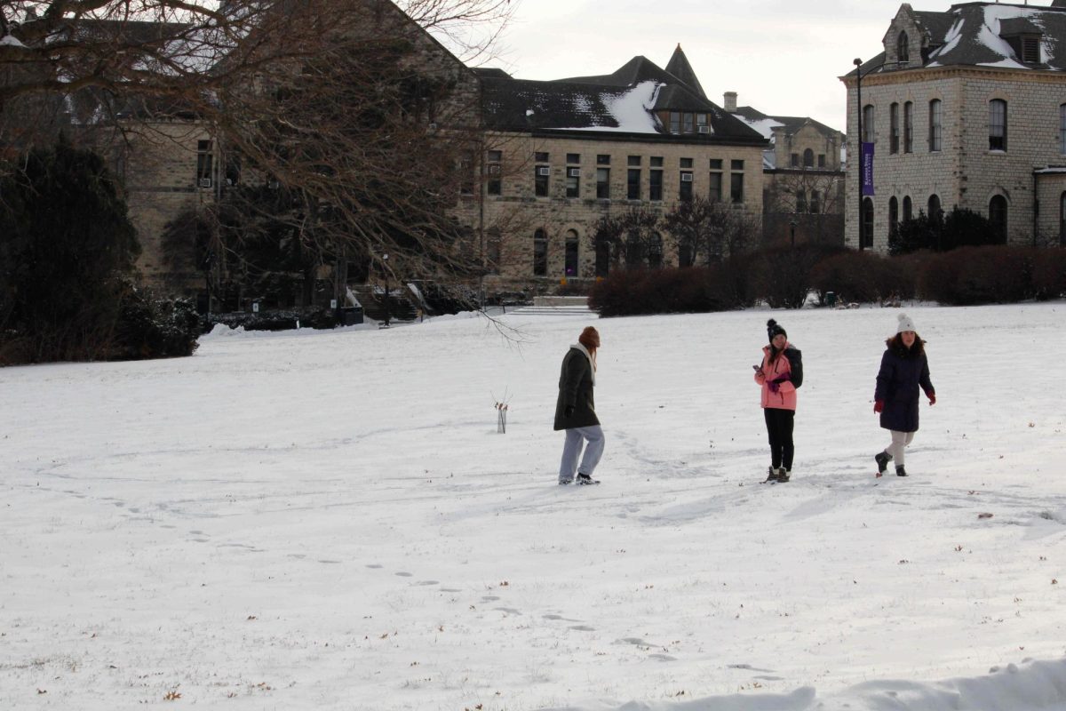 Students walk in the snow on Wednesday, Feb. 12.