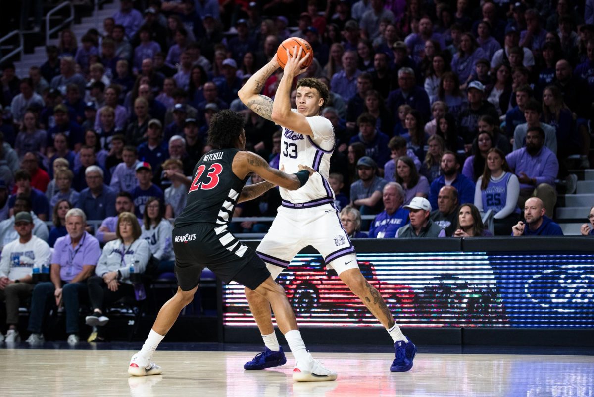 Forward Coleman Hawkins looks to pass during the first half against Cincinnati. Hawkins led the offense in scoring with 20 points as they defeated then-No. 16 Cincinnati 70-67 to open conference play on Dec. 30.


