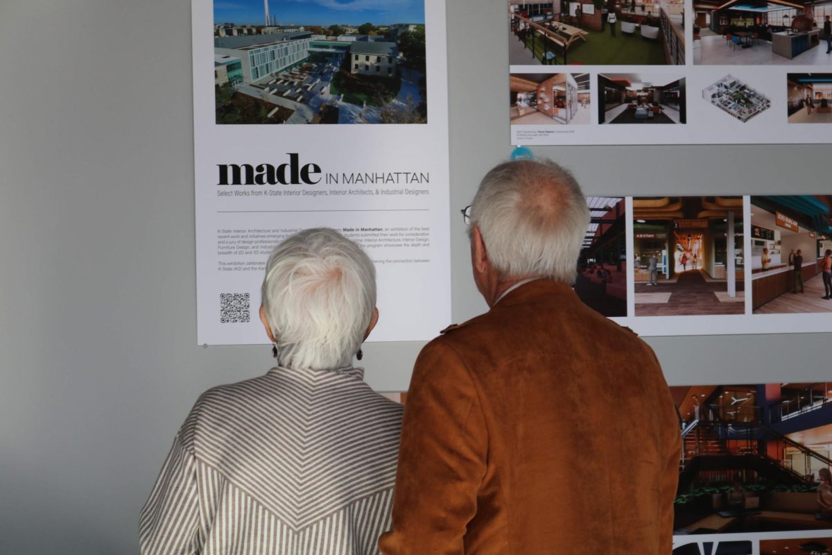 Attendees read information about the Made in Manhattan event. The exhibition took place at the Crossroads Hotel where select IAID students displayed semester-long projects.