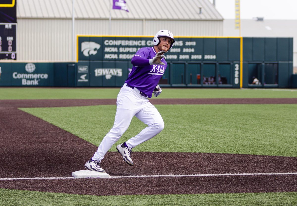 Keegan O'Connor shows the Wildcat symbol to the crowd after hitting a home run. The Wildcats defeated UCF 8-6 on April 13 at Tointon Family Stadium. 