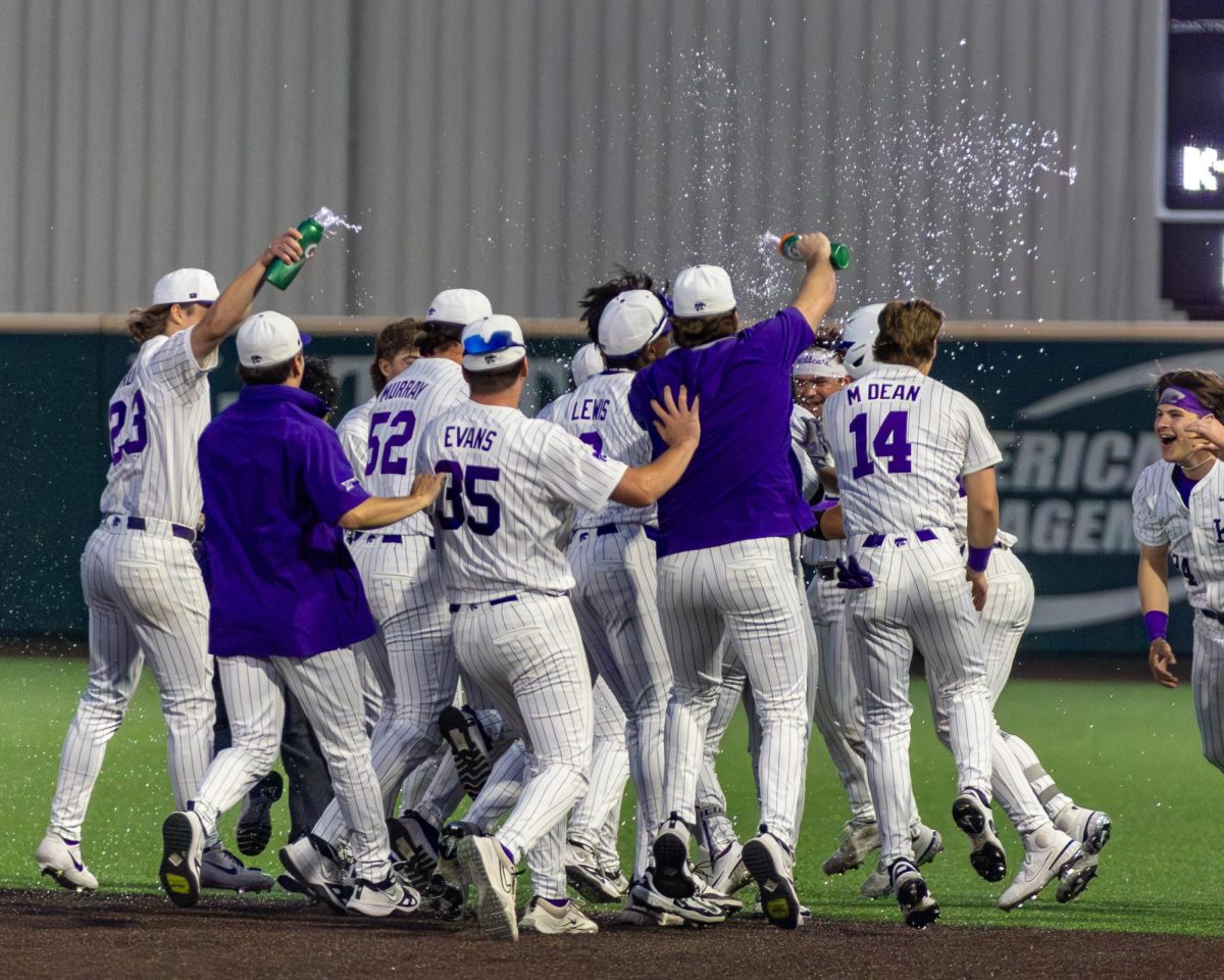 K-State players storm the field at Tointon Family Stadium after an 8-7 walk-off win over No. 12 West Virginia on Friday.