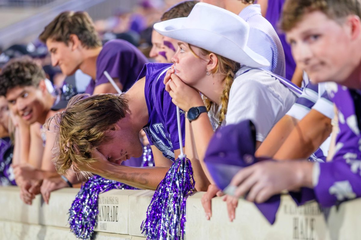 Disappointed with the outcome, a Kansas State fan puts his head in his hands after Army takes the lead during the fourth quarter. The Wildcats would fall to Army 24–21. 