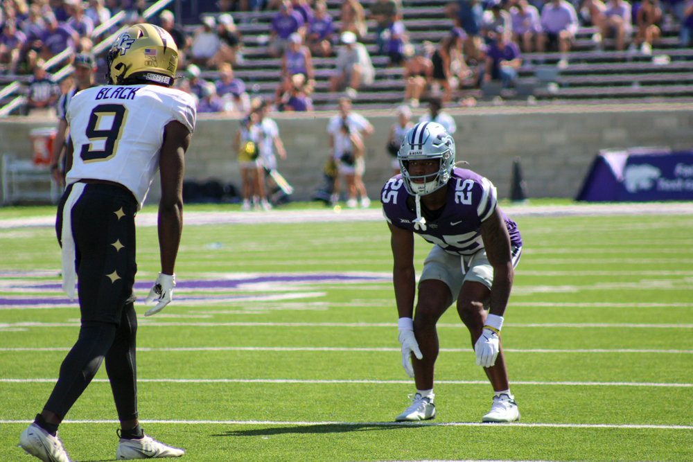 Zashon Rich (25) stays in strong defensive position, guarding UCF’s #9 Black during K-State’s 34-20 game on September 27. (Mindy Wells | Collegian Media Group)