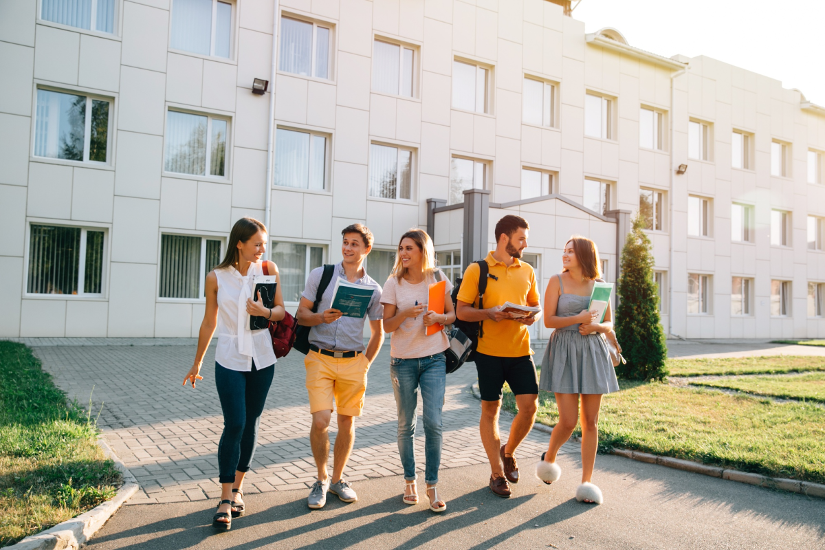 A group of college students walking on campus