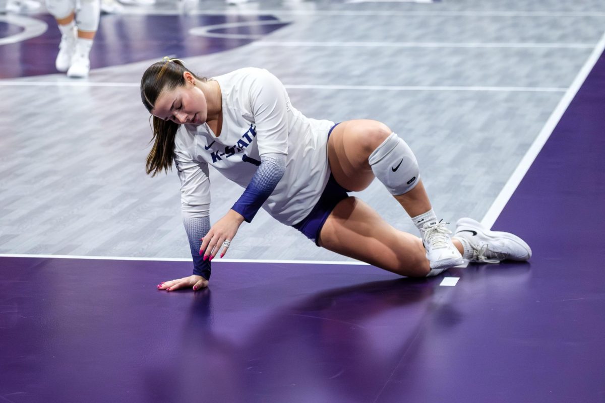 Libero Caleigh Ponn recovers after attempting to dig the serve that would leave Kansas State with a loss to Arizona on Sept. 26.  Kansas State fought hard against the hard-hitting Arizona offense, but fell in 4 sets. 