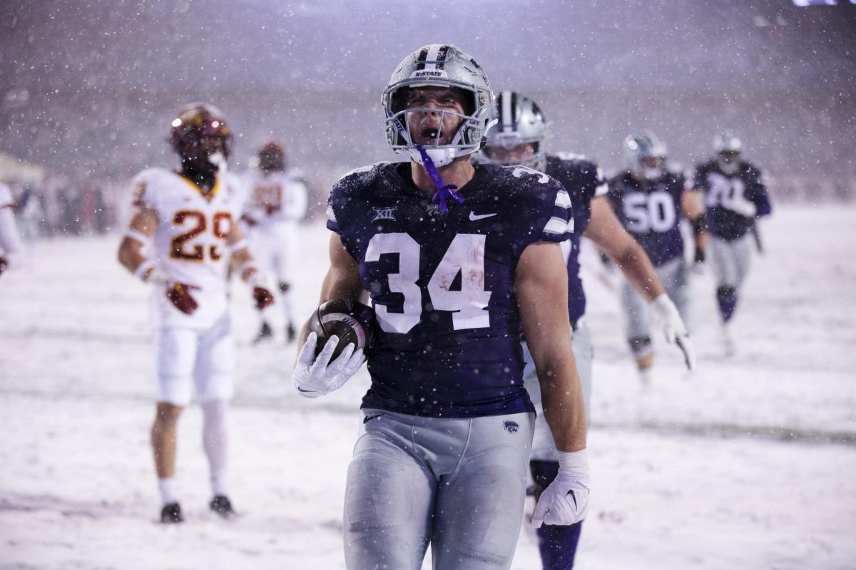 Yelling to the crowd, junior tight end Ben Sinnott celebrates after scoring a touchdown. Kansas State played Iowa State on November 25, 2023 in Bill Snyder Family Stadium. The Wildcats lost to the Cyclones 35-42. (Archive photo by Macy Franko)