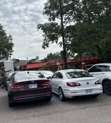 A cement truck fell on to parked cars near the Derby complex on Wednesday, Aug 27. (Photo courtesy of Sydney Stimpert)