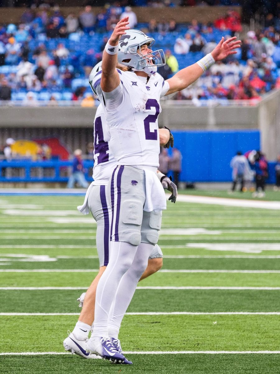 K-State quarterback Avery Johnson (2) celebrates to the K-State crowd who traveled to Lawrence for the 42-17 blowout victory over KU at David Booth Memorial Stadium on Oct. 25, 2025.