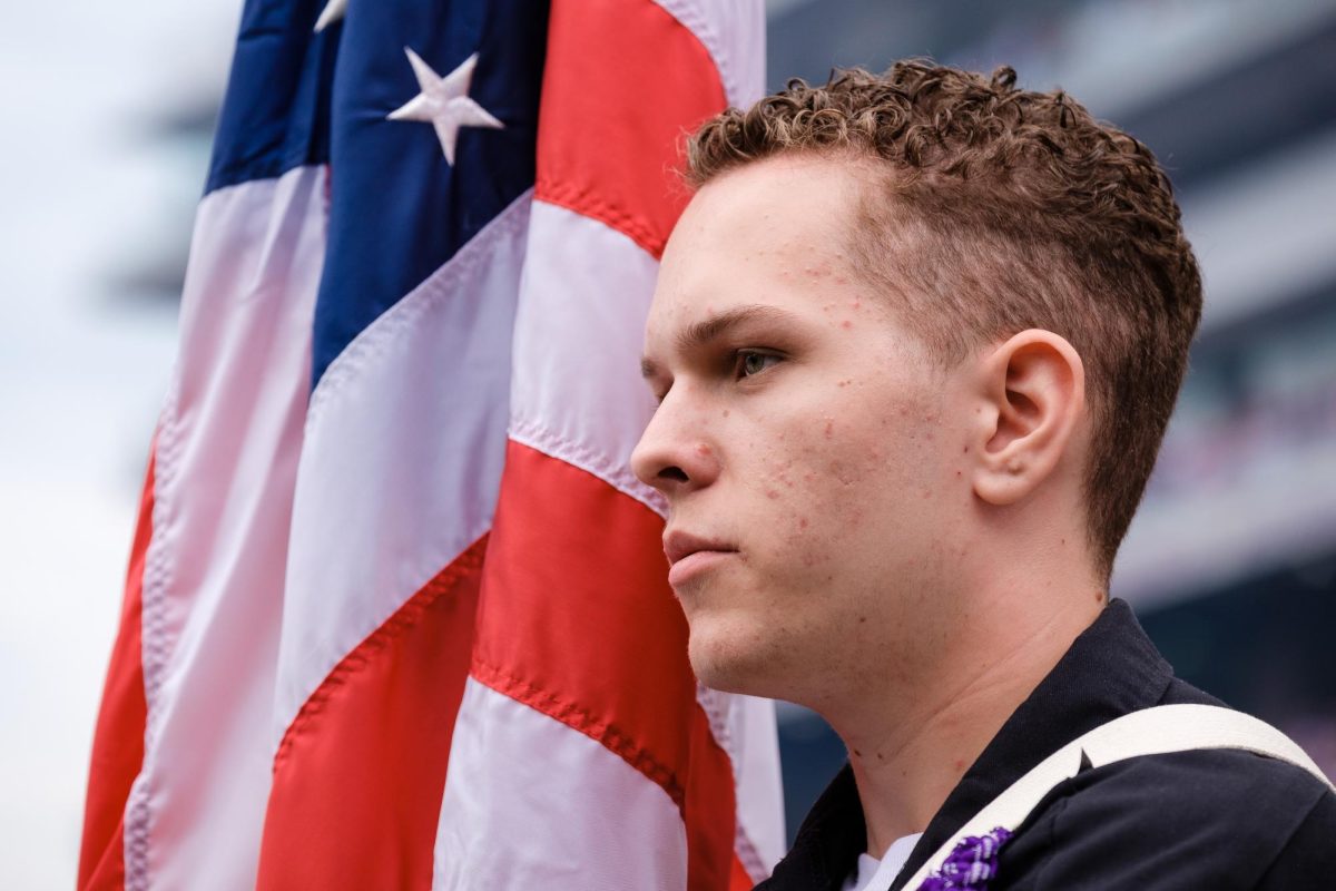 A flag bearer of the color guard for a K-State football pregame ceremony against North Dakota on Aug. 30 focuses while bearing the American Flag. 