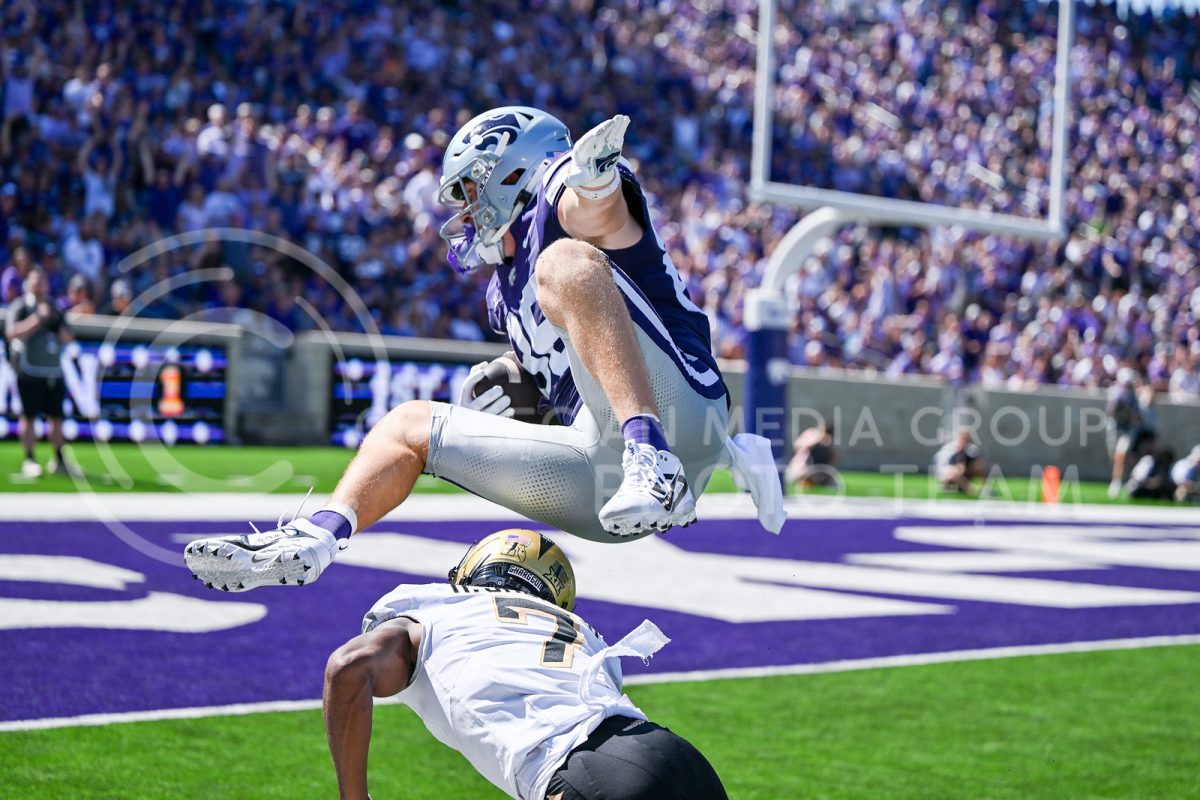 Junior tight end Garett Oakley leaps over UCF player in an attempt to rush towards the end zone. Oakley scored a touchdown two plays later during the third quarter.