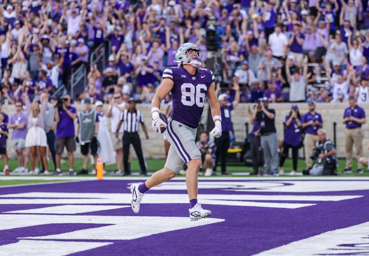 Tight end Garrett Oakley celebrates after scoring a touchdown against TCU. Oakley’s 11 career touchdown catches are the most by a tight end in K-State history. The Wildcats won against the Horned Frogs 48-21.