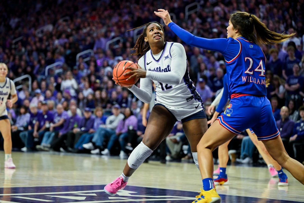 Kennedy Taylor looks to shoot the ball against Kansas. Taylor was one of the recognized senior players on Feb. 22, 2025 against the Jayhawks.
