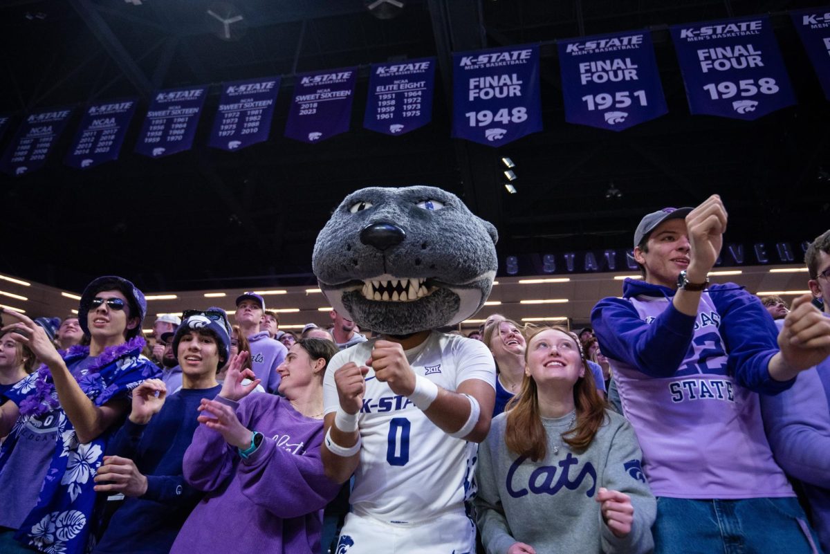 Mascot Willie the Wildcat and students dance to the Wabash Cannonball prior to the Kansas State Men_s Basketball v. Texas Tech game on January 15th.