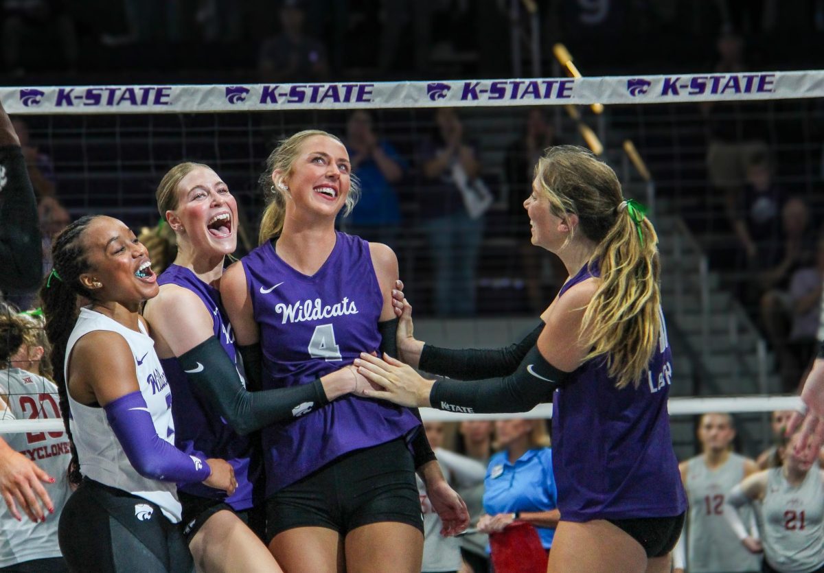 Reagan Fox is surrounded by teammates after blocking a hit from Iowa State. The Cats fell short on Oct. 8 in 5 close sets. 