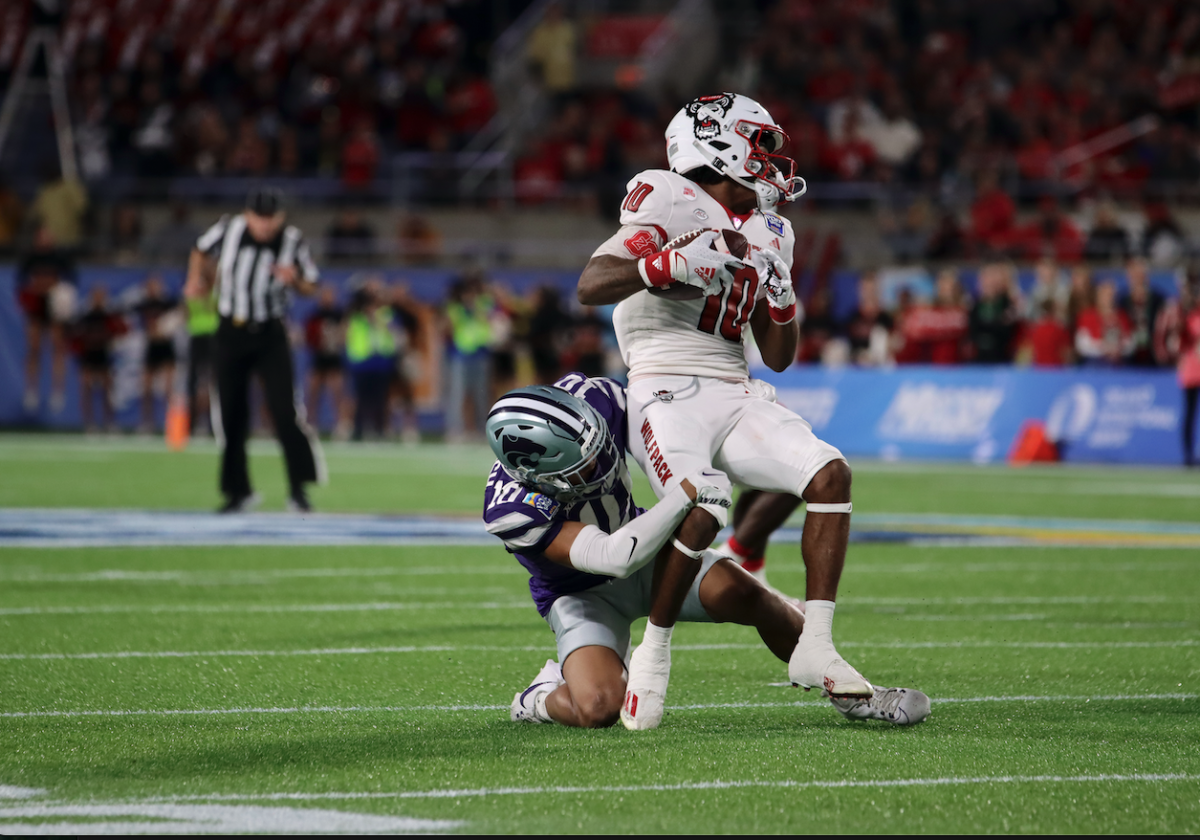 Cornerback Jacob Parrish tackles the offense during the Pop-Tarts Bowl. The Wildcats won the bowl game on Dec 28, 2023 with a final score of 28-19 against North Carolina State.
