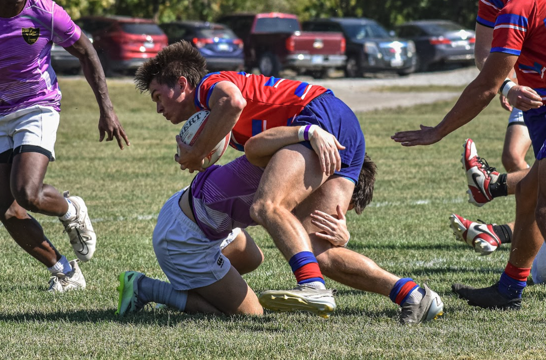 Freshman Aidan Skahan is making the tackle on the KU player with the rugby ball. KSUFR RFC was defeated by KU 26-47 on October 4th, 2025, at Lawrence Westwick Rugby Complex