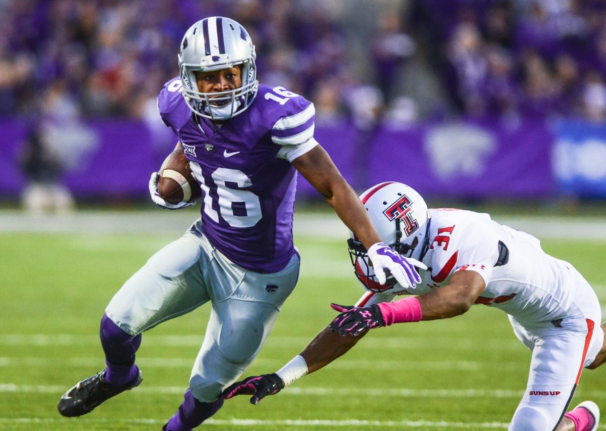 Senior wide receiver Tyler Lockett evades a tackle from Texas Tech defender  the Wildcats' defeat of the Red Raiders Oct. 4, 2014, at Bill Snyder Family Stadium. (Archive by Parker Robb)