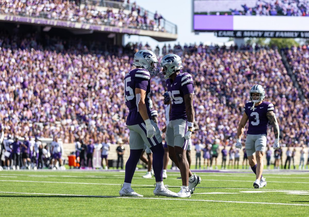 Zashon Rich celebrates a defensive stop with teammate Austin Romaine. The Wildcats defeated TCU 41-28 on Oct. 11 at Bill Snyder Family Stadium. (Haylee Haslett | Collegian Media Group)
