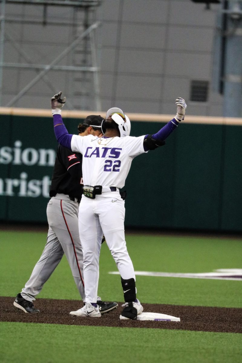 Kaelen Culpepper celebrates his double when making it to second base. Kansas State baseball finished strong with a 3-2 win over Texas Tech on April 28, 2023. 