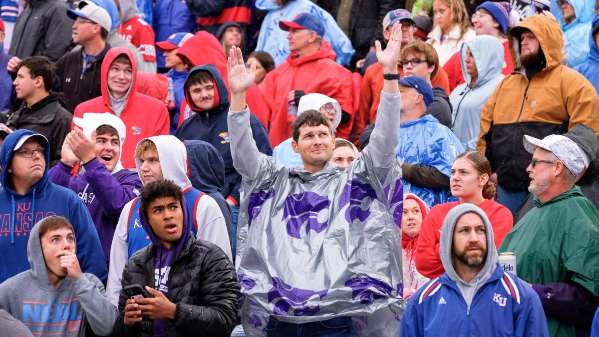 K-State fans celebrate a touchdown as KU fans react with amazement and disappointment following an impressive Avery Johnson touchdown pass to Jayce Brown at David Booth Memorial Stadium on October 25, 2025.