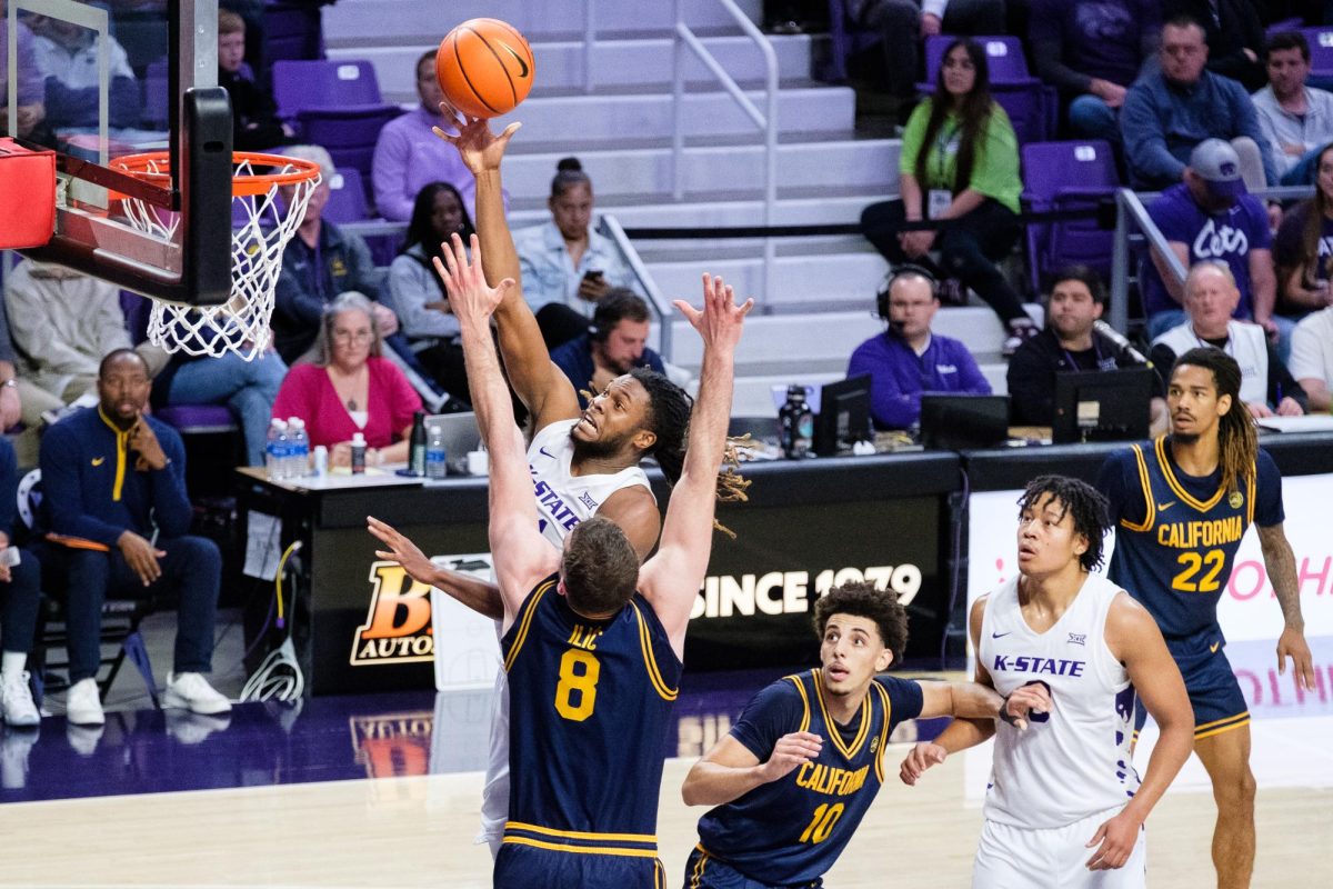 Forward Khamari McGriff (21) fights through the defense of the California Bears for a layup on November 13, 2025. McGriff was one of three Wildcats to finish with more than twenty points in the 99-96 thriller in Manhattan.