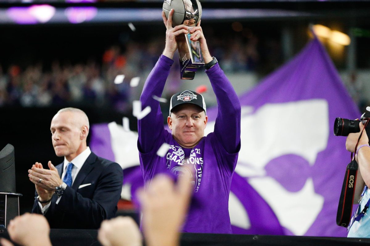 Head coach Chris Klieman hoists the Big 12 Champion trophy after defeating TCU in overtime 31-28 on Dec. 3. (Archive photo by Macey Franko | Collegian Media Group).