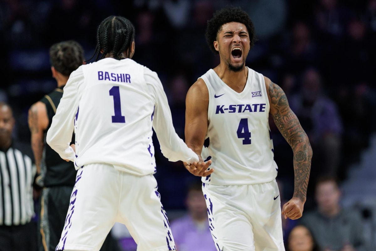 Kansas State guard Abdi Bashir Jr. (1) and Kansas State guard PJ Haggerty (4) celebrate during the second half of an NCAA basketball game between the Kansas State Wildcats and the UCF Knights on Wednesday, Jan. 14, 2026, at Bramlage Coliseum in Manhattan, Kan. 