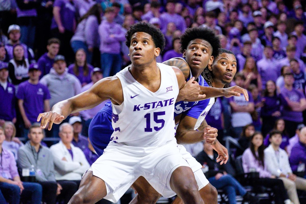  Wing Taj Manning (15) boxes out a Seton Hall player during a free throw at Bramlage Coliseum on December 6, 2025. Manning finished with 4 rebounds in the 78-67 loss to the Pirates.  