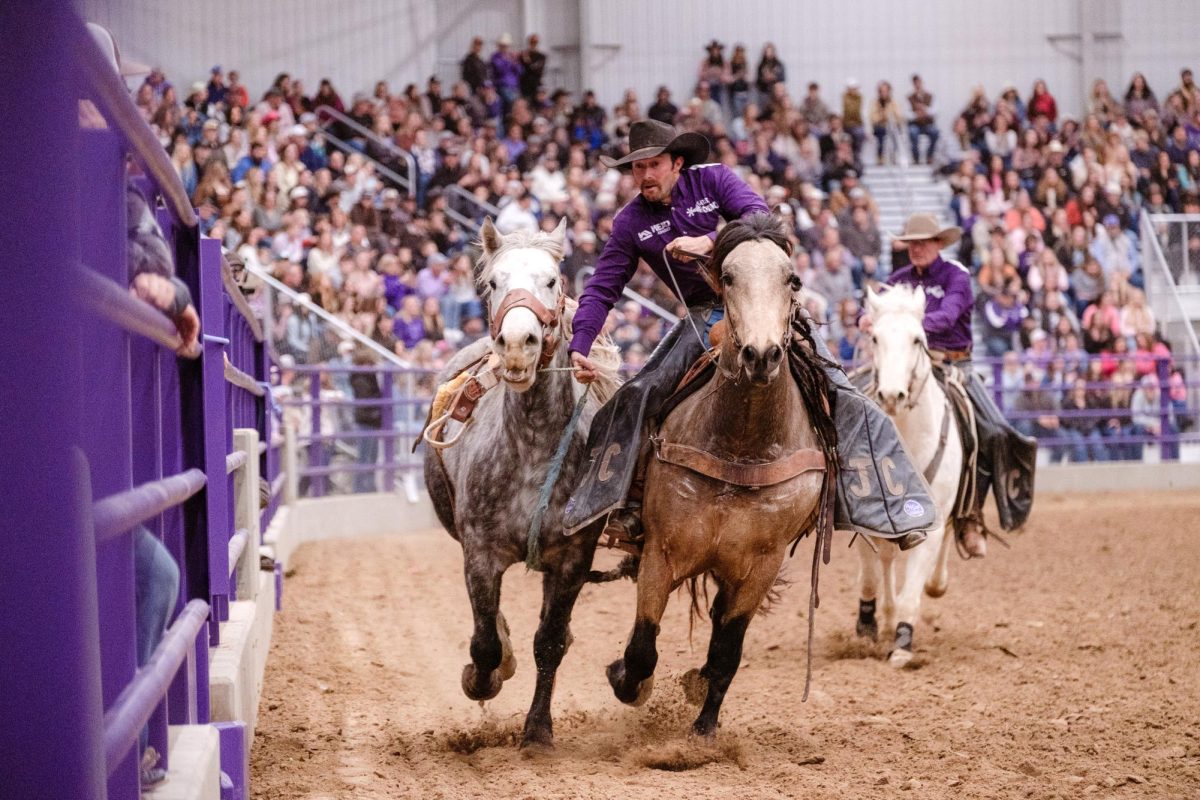 A rodeo cowboy wrangles a horse after a competitive event during day 1 of the K-State Rodeo on Feb. 19, 2026 at Bilbrey Arena. 