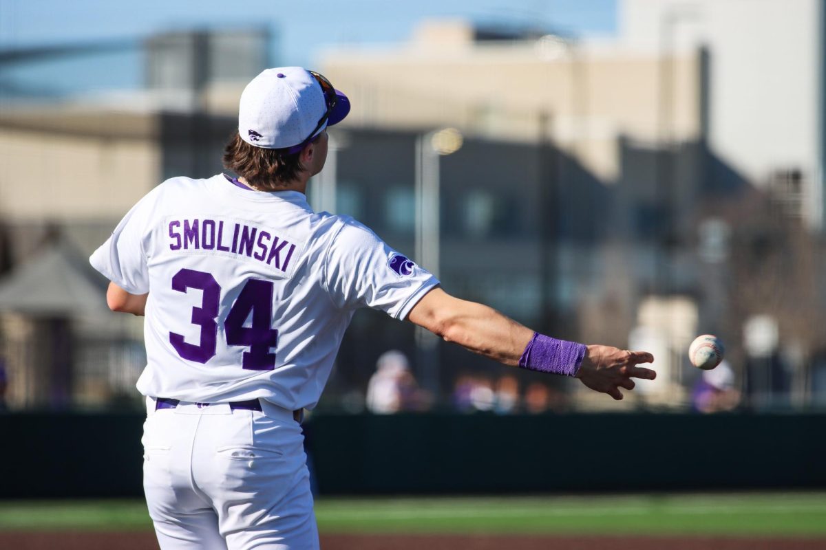 Infielder Ty Smolinski throws a grounder to a teammate during warm-ups. Smolinski smashed his first home run of the season, giving the Wildcats a 3-2 lead against Columbia on Feb. 28 at Tointon Family Stadium.